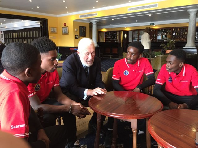 Sir Robin with students from Greig Academy