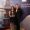 Lucy MacGregor with the coveted trophy, congrtulated by MS Amlin's Keith Lovett
